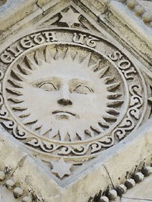 Relleu del Sol a la façana l'església de Santa Maria de Portbou, església construïda per Joan Martorell el 1879